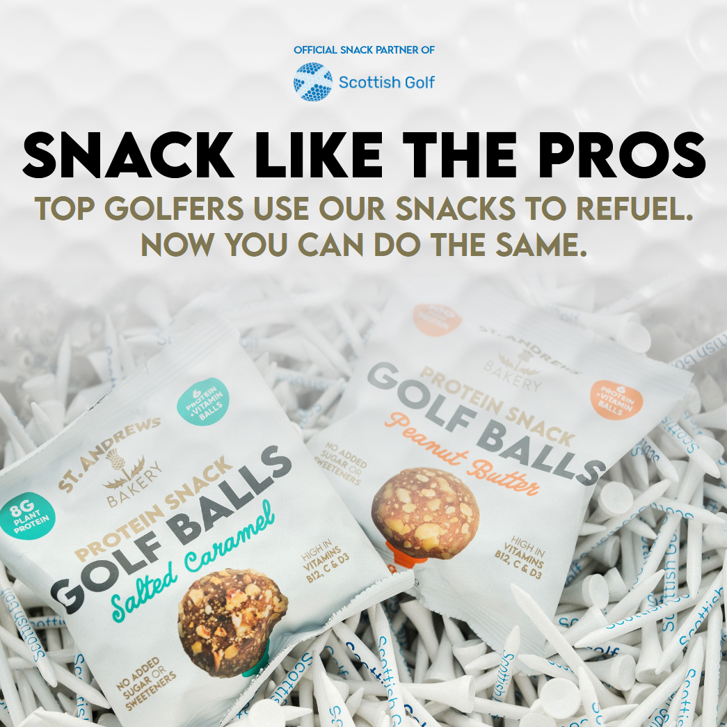 Two packs of St Andrews Bakery Protein Snack Golf Balls in Salted Caramel and Peanut Butter flavours resting on a bed of white golf tees, with text "Snack Like The Pros" and Scottish Golf official snack partner logo.