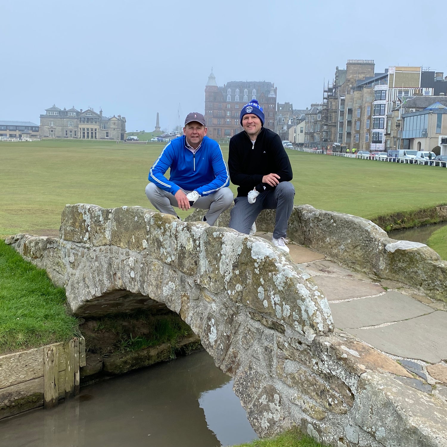 Richard Crabtree and Jim Mosley, founders of St Andrews Nutrition, standing on the Swilcan Bridge at the Old Course in St Andrews